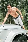 Amateur gay Cody Cummings shows his cock and poses in the back