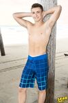 Young Gibson poses on the beach then goes inside and strips to show his