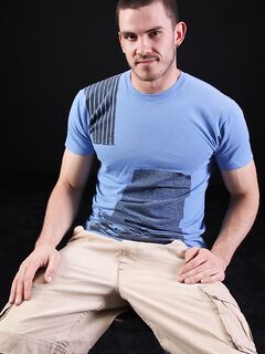 Dark-haired gay model Vander unveils his big hairy cock as he strips