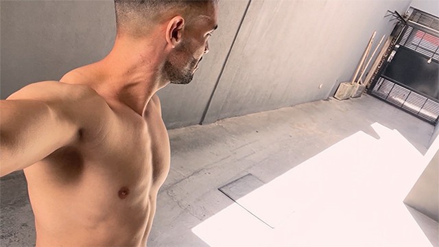 Handsome guy walks naked on public parking garage and next to crowded