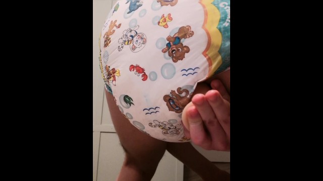 Boy fucks his own ass through soaked 24h diaper