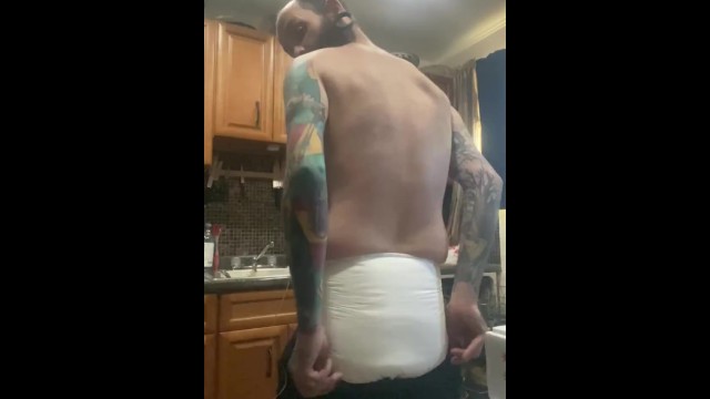 Diaper slave boytoy doing dishes for master with butt plug in