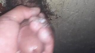 Jerking off at the gloryhole