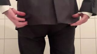 Nappy twink wearing a full nappy under his suit at work