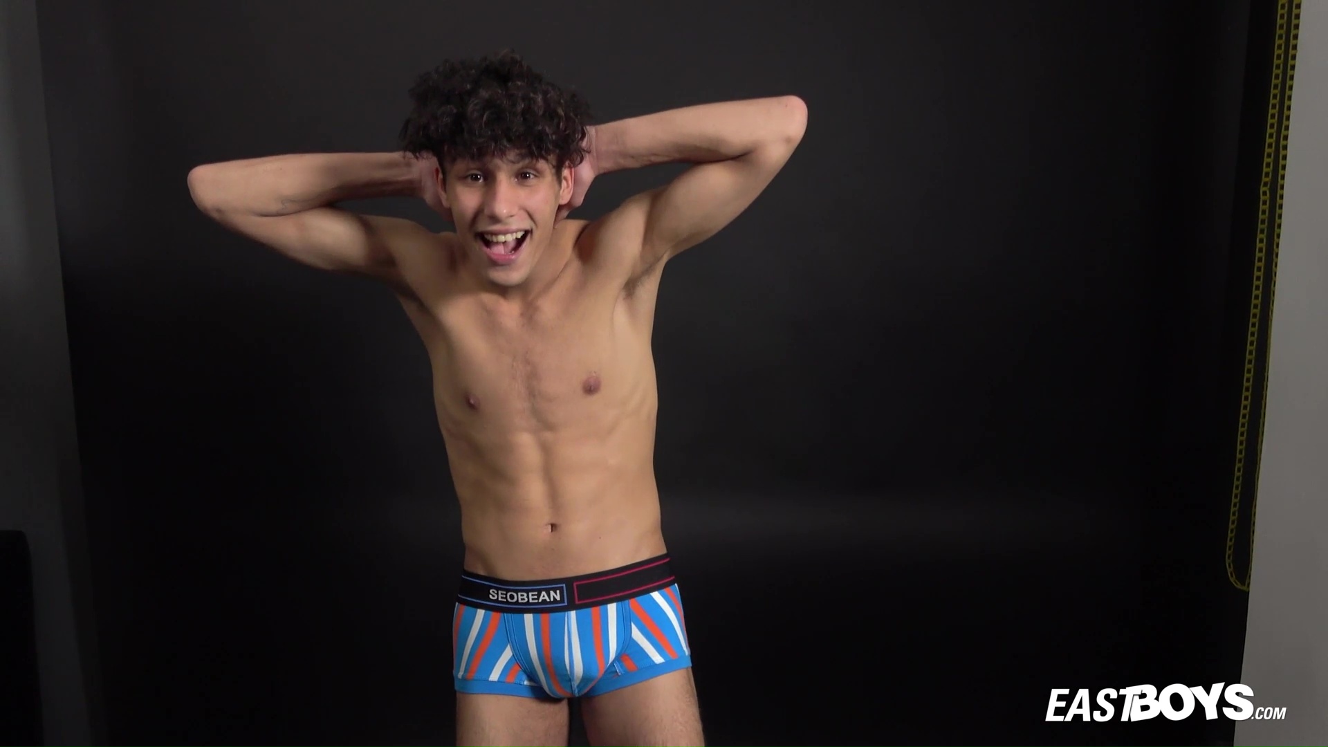 Curly twink boy shows off his slim body on webcam