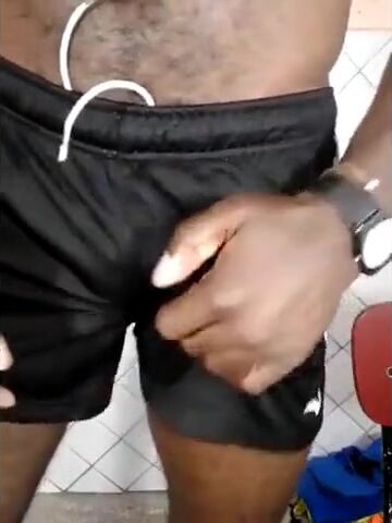 Big-Headed Black Cock in Shorts