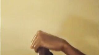 Black guy jacks off his big cock and cums hard
