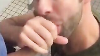 Hunk gives blowjob in a public restroom - amateur gay porn