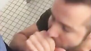 Hunk gives blowjob in a public restroom - amateur gay porn