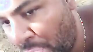 Bear Sucks and Swallows Outdoors