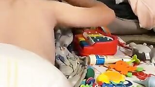 Diaper boy watching TV with mommy
