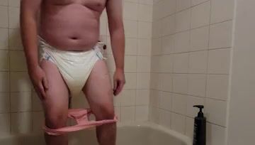 Chubby Diaper Boy Shows Off His Wet Diaper & Caged Cock