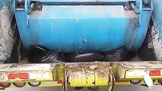 Garbage truck rear loader crushing diapers