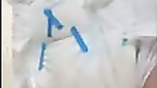Diaper Boy Pees into already soaked diaper