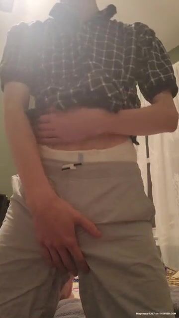 Diaper boy undressing and playing with soaked diaper
