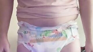Diaper boy wets fresh paddin