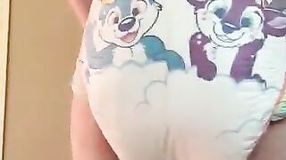 Diaper boy pushes mush into thick diaper