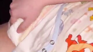 Diaper boy moans while cumming into diaper