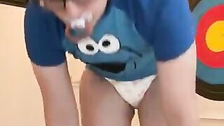 Baby boy strips and shows of his diaper