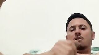 Latino faggot pleasures his ass with his fingers