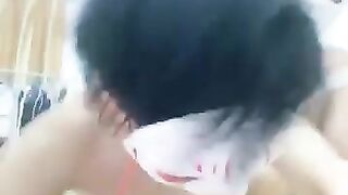 Asian boy sucking toes