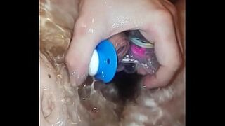 he plays with his nipples while taking a bath and takes a lot of