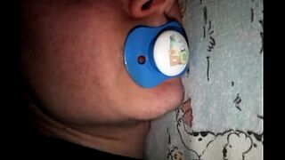 He sucks his pacifier like a cock while s.