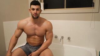 Muscle bodybuilder takes a bath and worships his soapy body