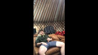 Horny man alone in the wilderness chops wood and sprays his cum