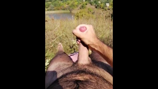 Hairy straight dude jerks off and cums in nature
