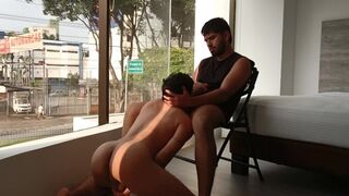 fucking hard and bareback in a hotel window with people passing by